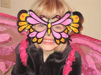 Molly in her butterfly mask