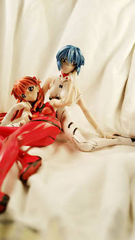 Injured Rei and Asuka sitting