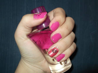 Magenta nails and a bottle of plummy perfume