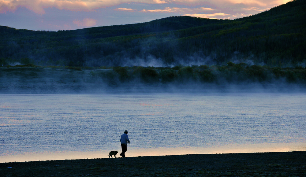 Old man and his dog.