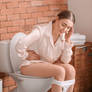 Woman having diarrhea - Stock photo