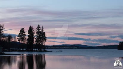 Pink sunset with clouds in blue and purple