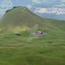 Chalet on green mountain slope