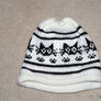 Knitted hat with black cats