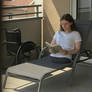 Leg amputee on a balcony 2