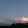 surfers in the waves of the sky