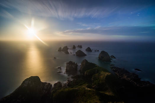 Rising moon over Nugget point