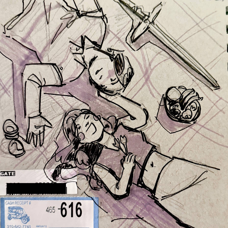 Connor and Dawn are pictured laying down opposite of eachother at a picnic