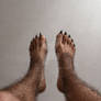 Feet up in the air, mid transformation.