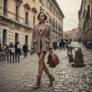 woman in tweed jacket walking down the street 