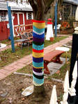 yarn bomb tree by knittleson