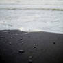 black sand white waves