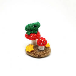 Mini amigurumi toad on a toadstool crochet artwork