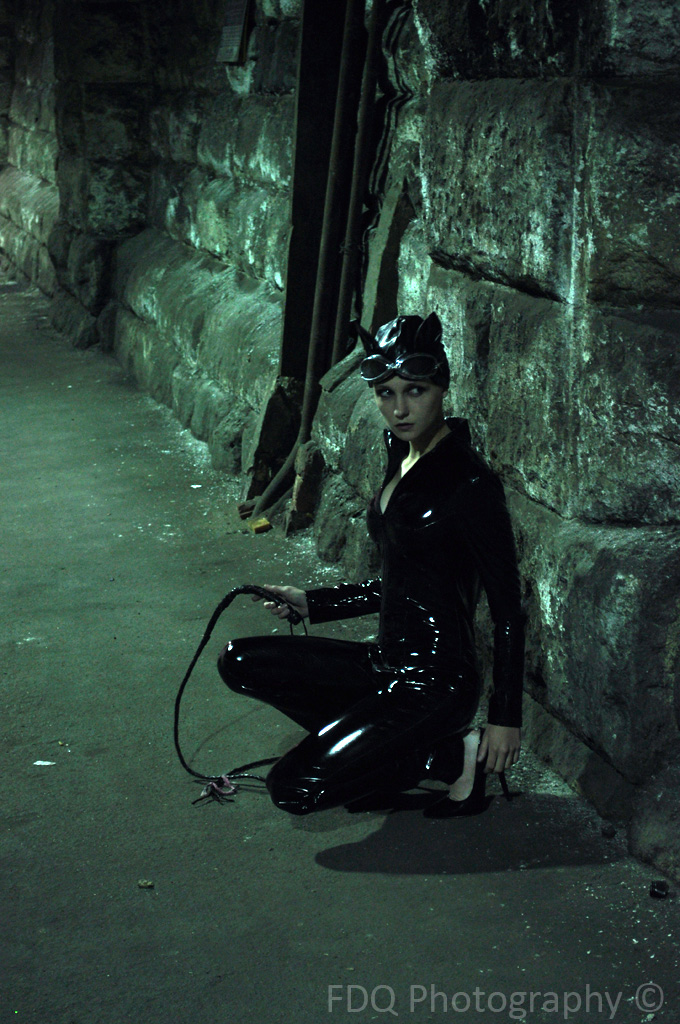 Catwoman with her back against the wall