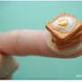 Miniature eggs and toast.