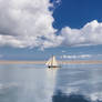 sailing boat between clouds