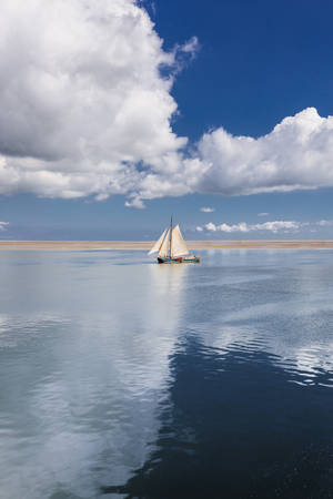 sailing boat between clouds by StefanPrech sailing boat between clouds by StefanPrech