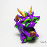 Purple, Green and Gold Dragon Holding a Bead