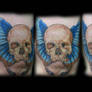 Skull butterfly tattoo