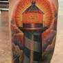 Traditional lighthouse tattoo