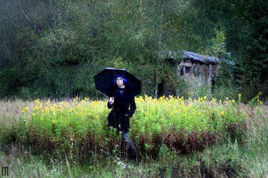 In the rain with umbrella