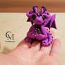 violet dragon with gemstone