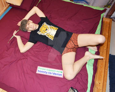 beautiful boy in underpants relaxes at his bed