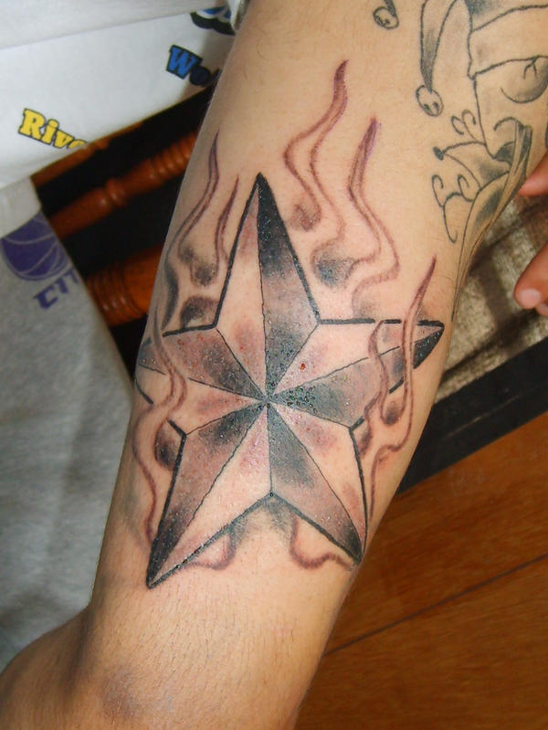 flaming nautical star tattoo
