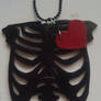 rib cage with heart necklace