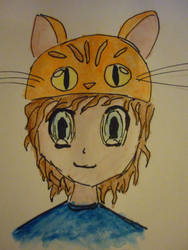 Boy with orange tabby cat hat