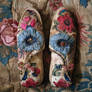 Now Two Pairs Of Shoes With A Pink And Blue Flower