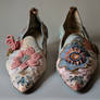 Now Two Pairs Of Shoes With A Pink And Blue Flower