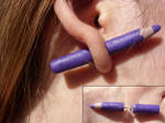 polymer clay purple pencil FAKE ear expander by trollwaffle