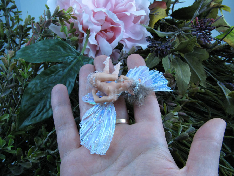 Thumb fairy on the hand