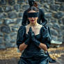 Kneeling blindfolded on the scaffold