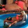 Chubby Helena floating in a inflatable pool