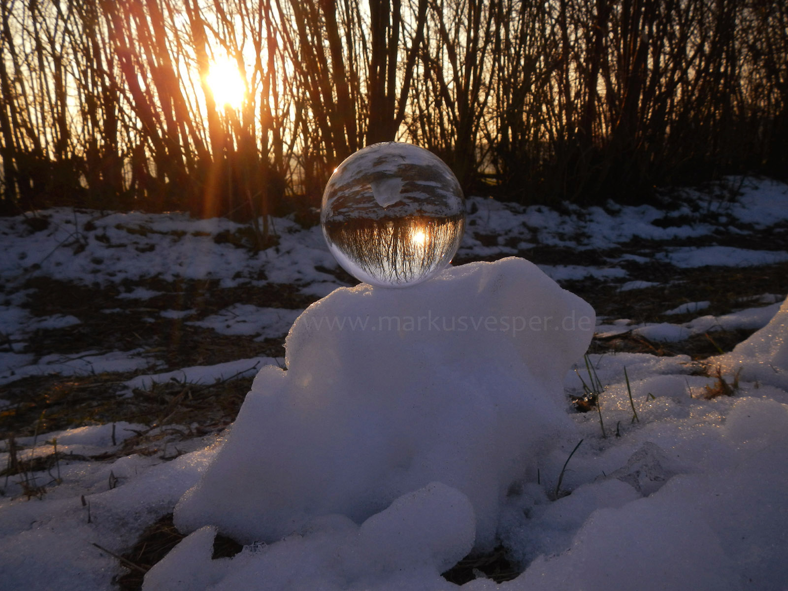 Crystaline sphere on snow pile