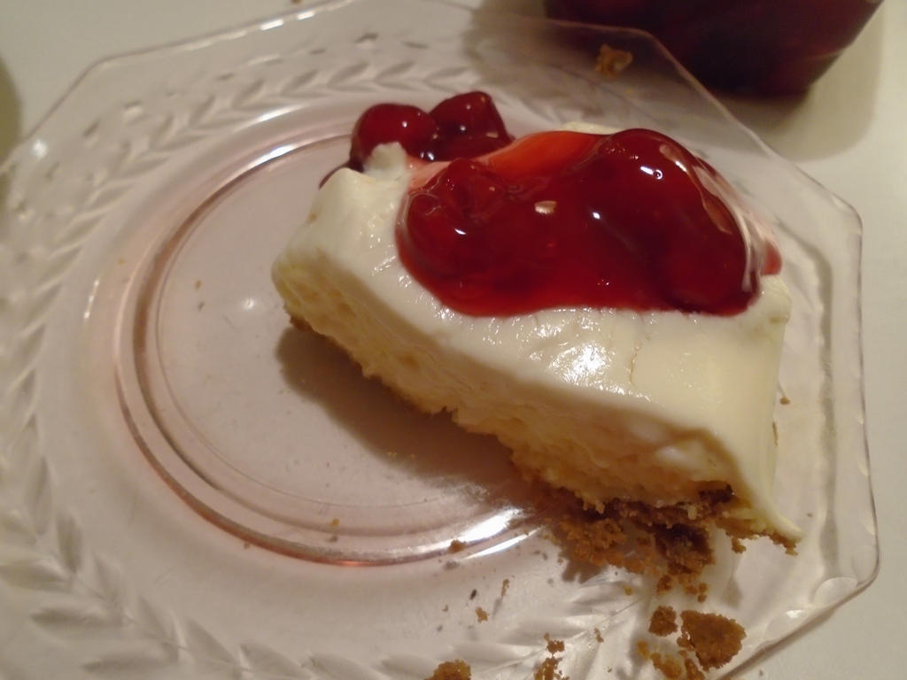 A slice of cherry cheesecake