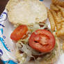 Seafood sandwich and fries