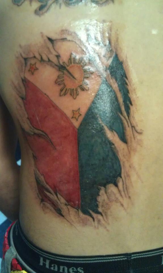 Phillipino flag with ripped skin tattoo by soldiersinktattoos on DeviantArt
