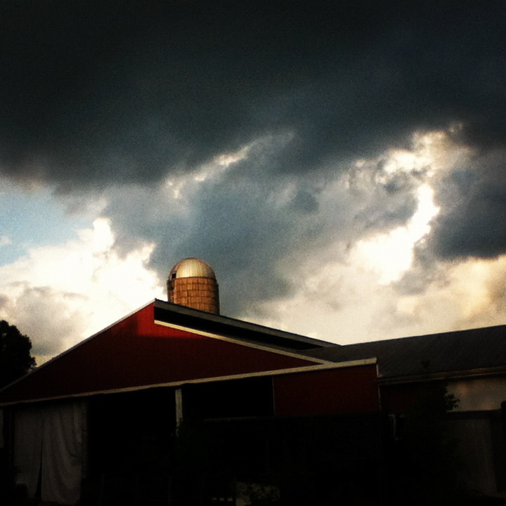 Clouds, barns, and Silo.