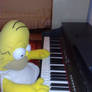 Homer J. Simpson:playing piano