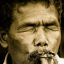 blind man playing a flute