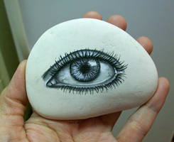 Eye painted onto rock