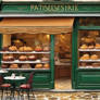 bustling French patisserie on a cobblestone street