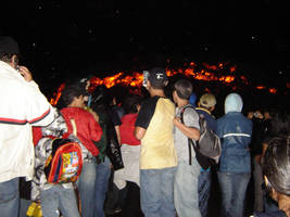 People at volcanos lava