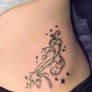 swirls and stars tattoo