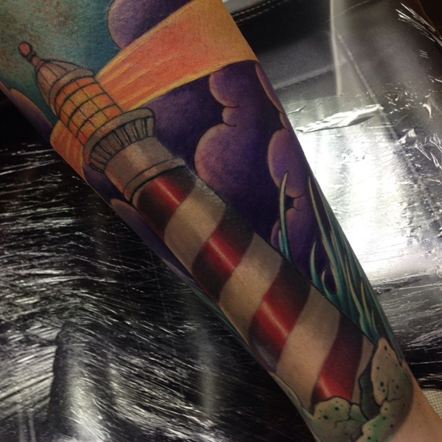 Nautical lighthouse sleeve tattoo by Craig Holmes