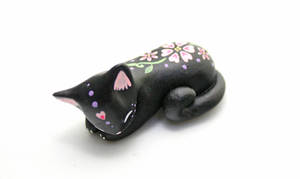 Black sleeping Floral Kitty