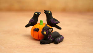 Two Ravens, a Cat, a Spider and a Pumpkin